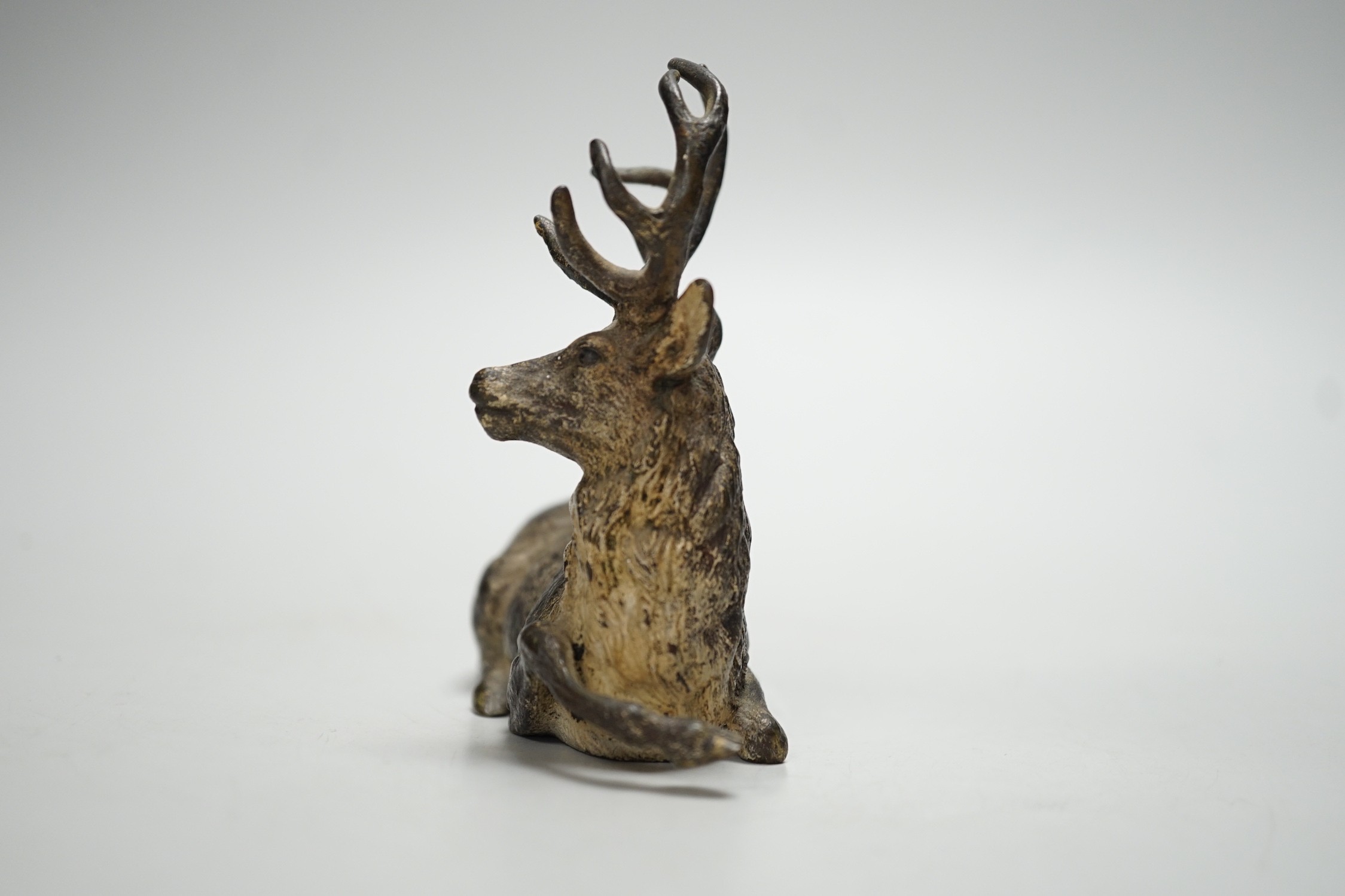 A Viennese cold-painted bronze model of a deer. 11cm wide